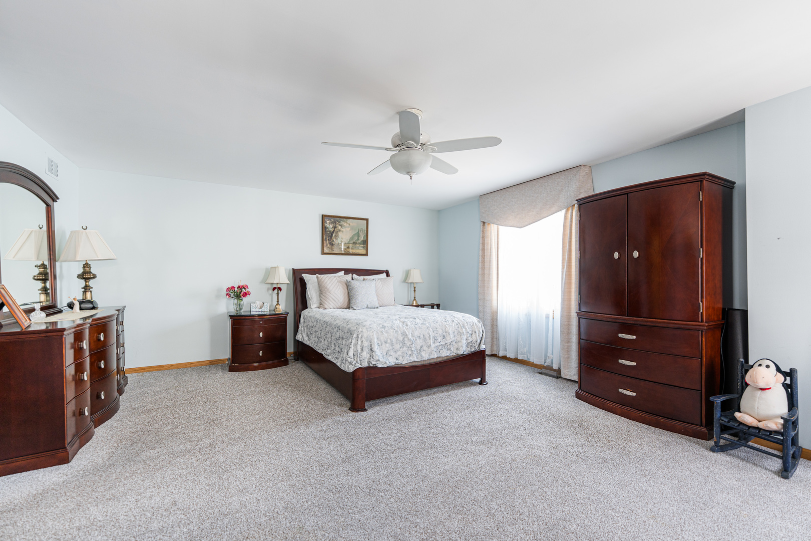 1607 Park Ridge Point Park Ridge, IL 60068 - Photo 17 of 41 a spacious bedroom with a bed and a dresser in it