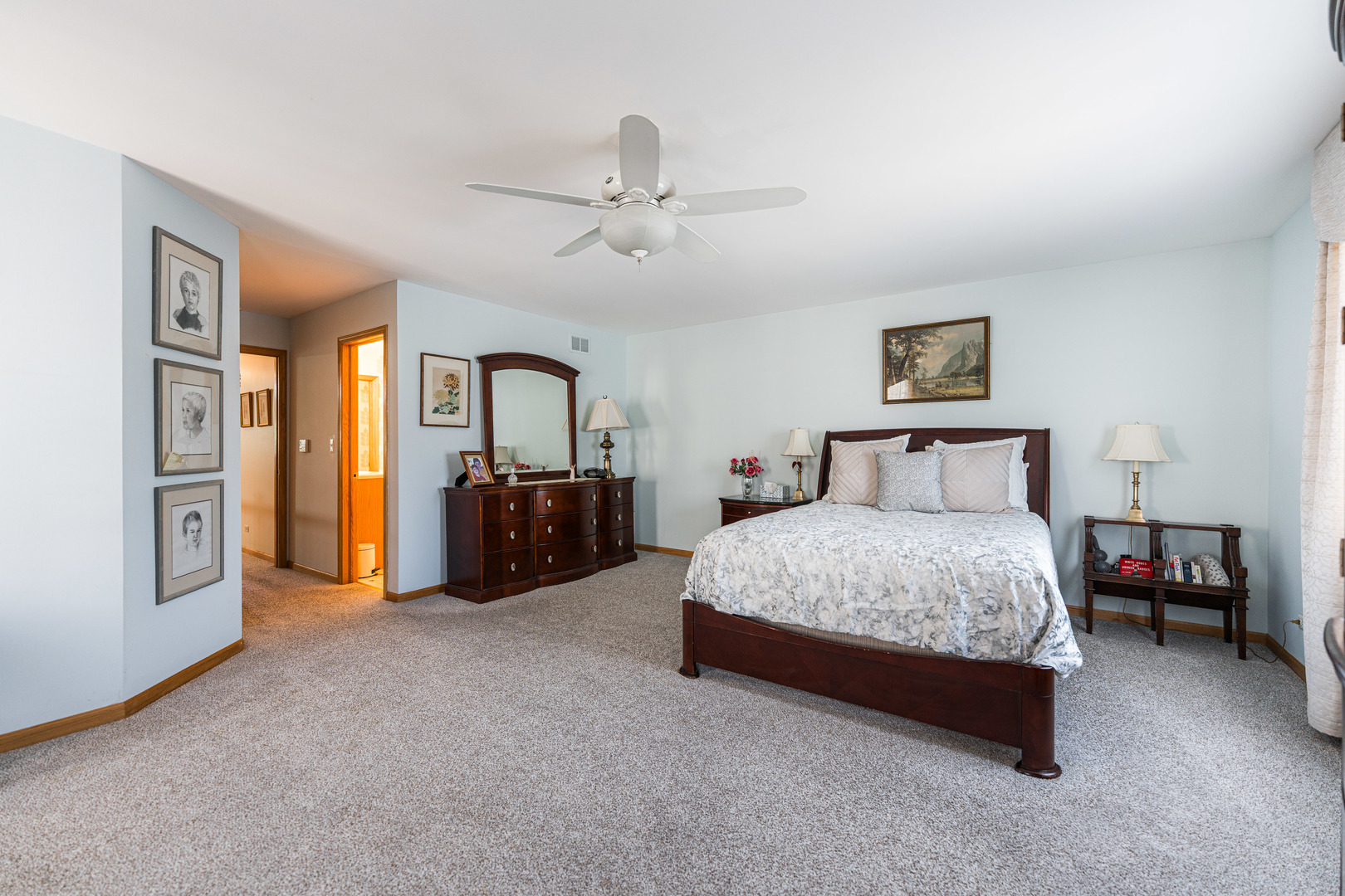 1607 Park Ridge Point Park Ridge, IL 60068 - Photo 23 of 41 a spacious bedroom with a bed cabinets and a window
