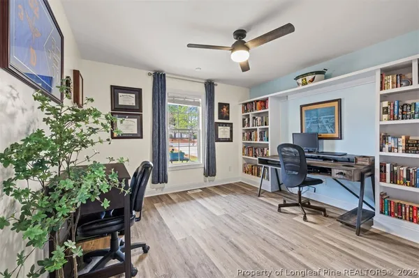 a workspace with a bookshelf