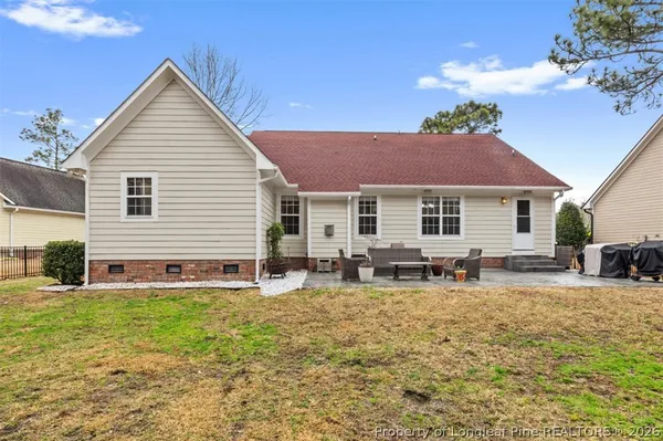 a front view of house with yard and seating space