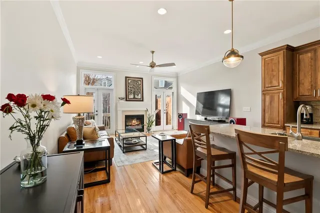 a bedroom with a bed couch and a large window