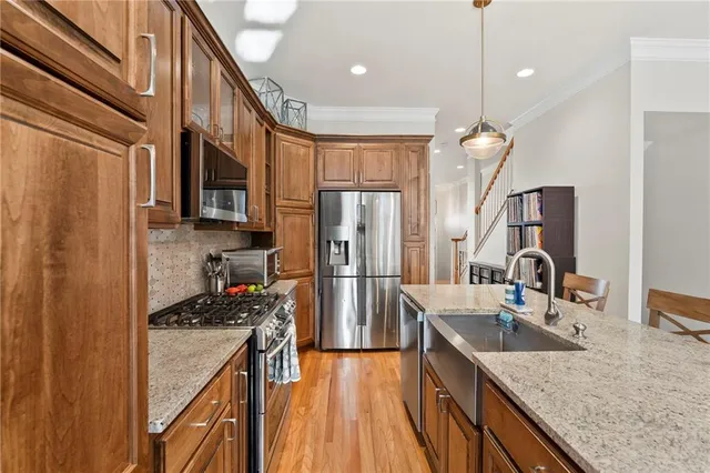 a spacious bathroom with a double vanity sink toilet and shower