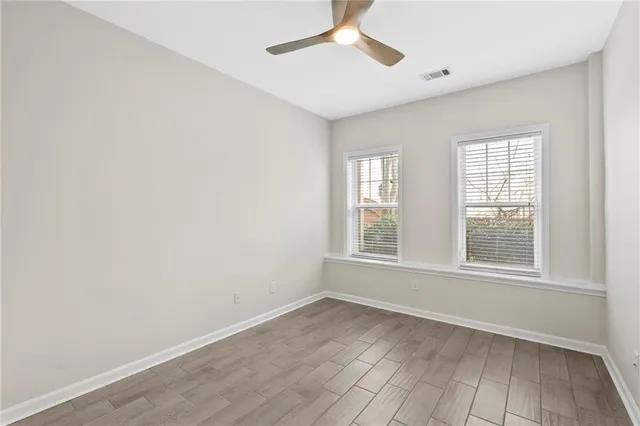 a view of balcony with wooden floor and outdoor seating