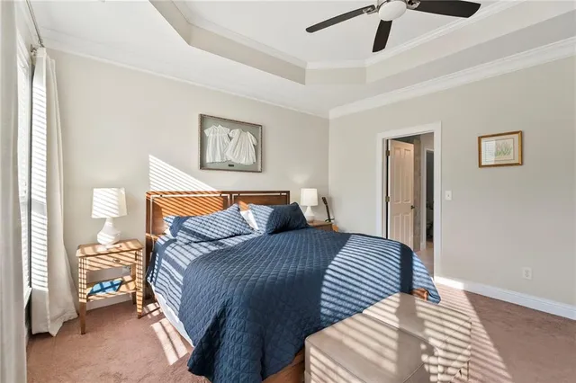 a front view of a house with garden and trees