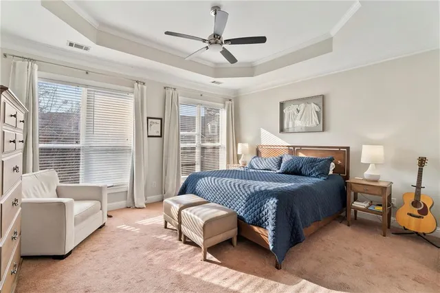 a front view of a residential apartment building with a yard