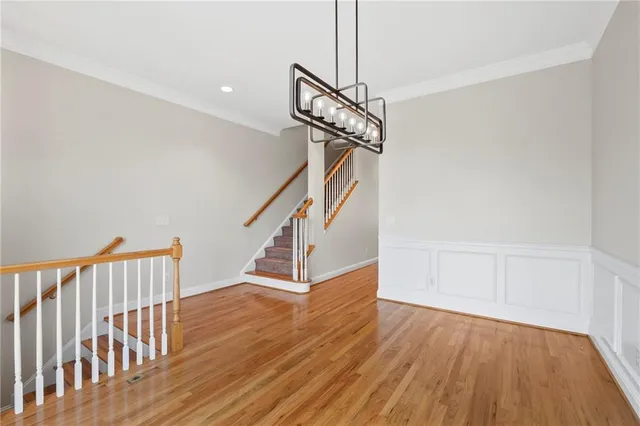 a kitchen with stainless steel appliances granite countertop a sink refrigerator and microwave