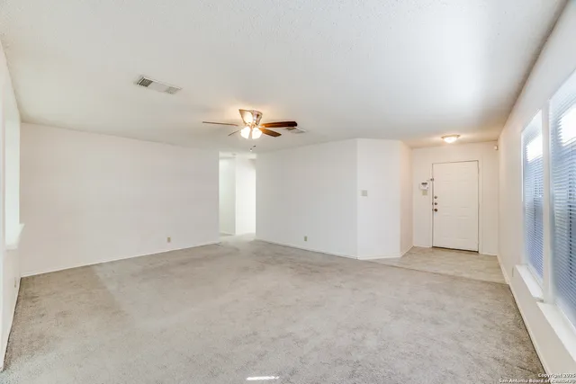 an empty room with a bathroom