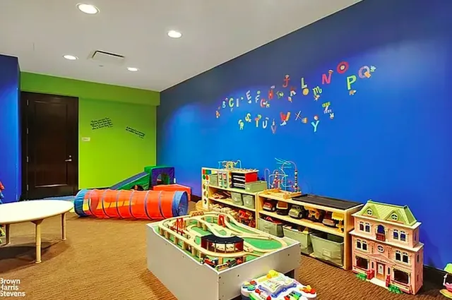 a bedroom with furniture and a lamp