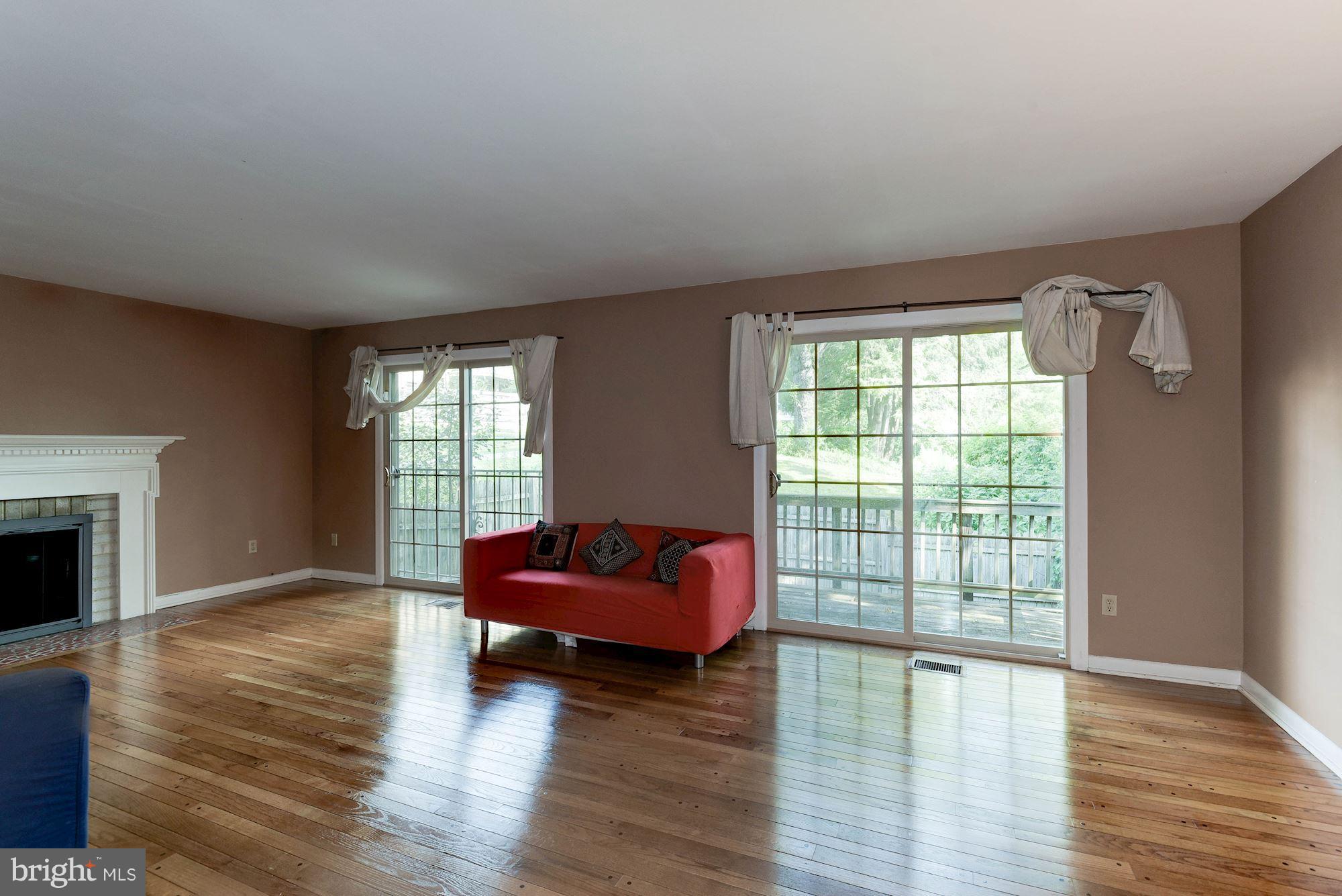 2148 Military Road Arlington, VA 22207 - Photo 2 of 28 a living room with furniture and a fireplace