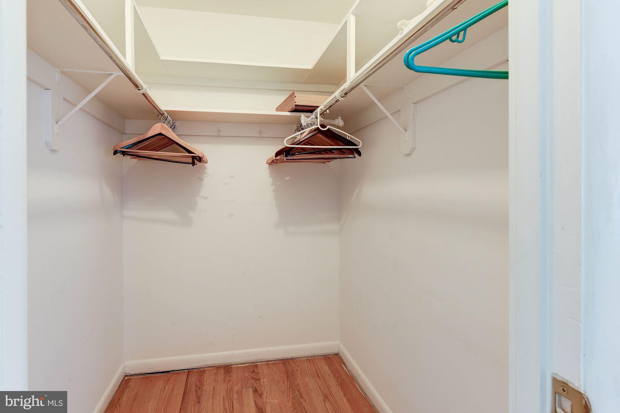 2148 Military Road Arlington, VA 22207 - Photo 15 of 28 a view of walk in closet with empty racks