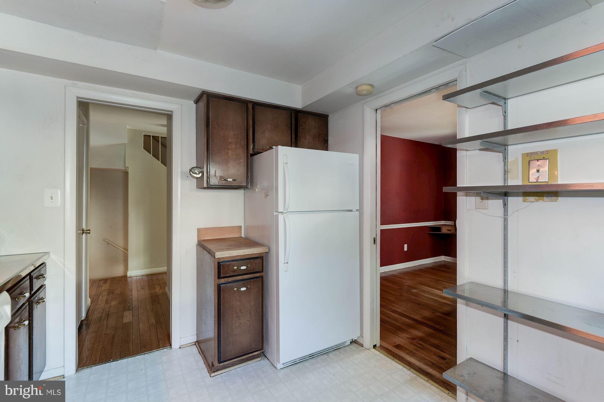 2148 Military Road Arlington, VA 22207 - Photo 17 of 28 a kitchen with a refrigerator and a stove