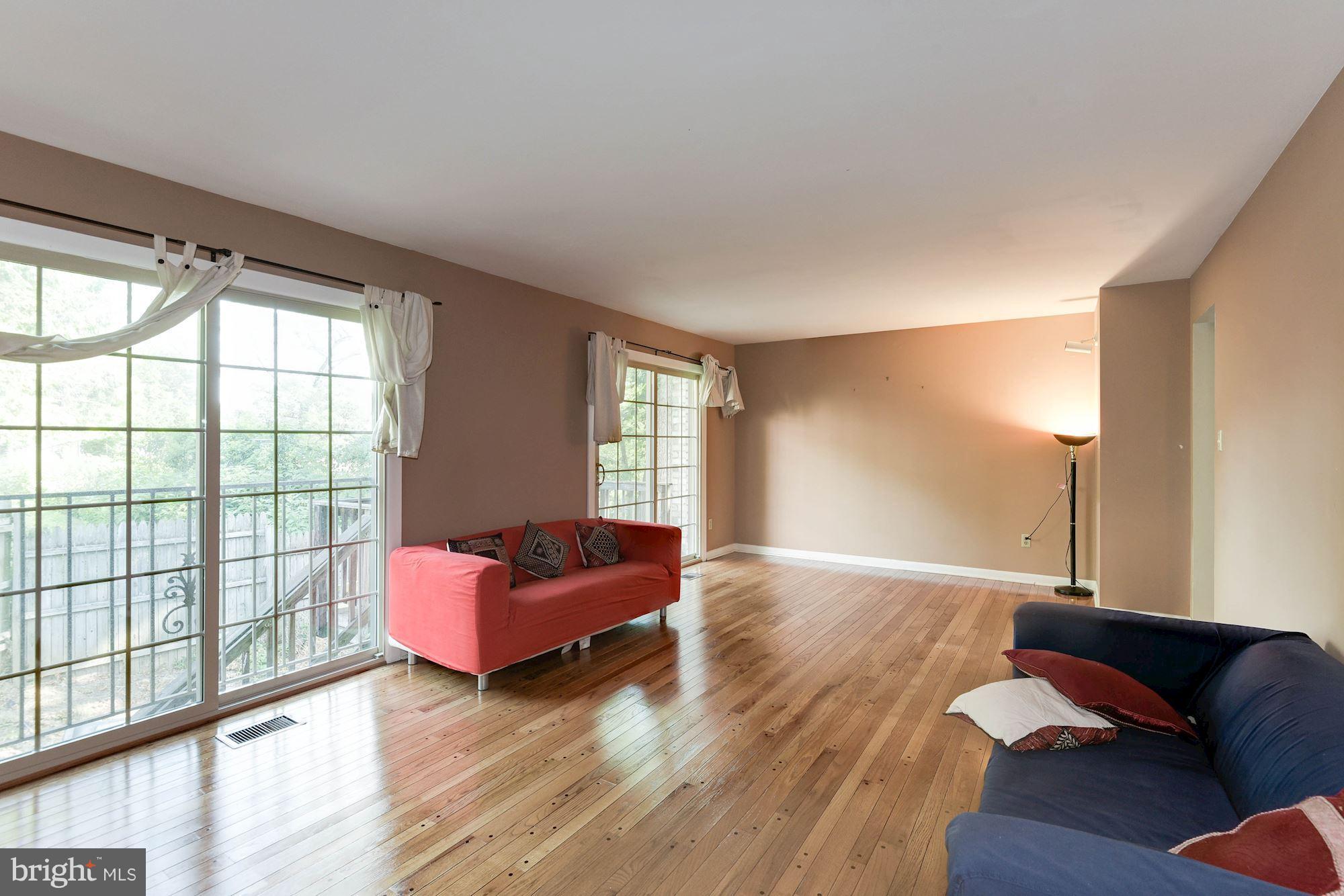 2148 Military Road Arlington, VA 22207 - Photo 18 of 28 a living room with furniture and a large window