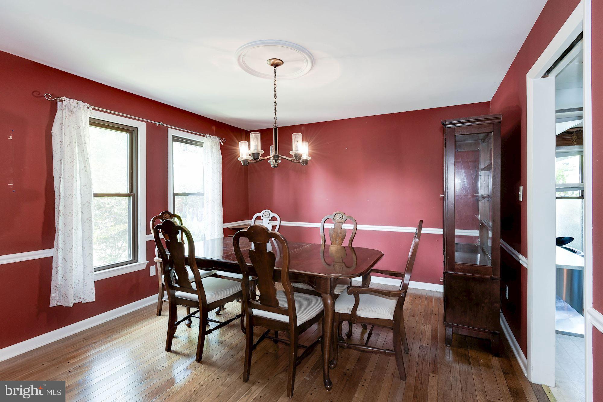 2148 Military Road Arlington, VA 22207 - Photo 3 of 28 a view of a dining room with furniture window and wooden floor
