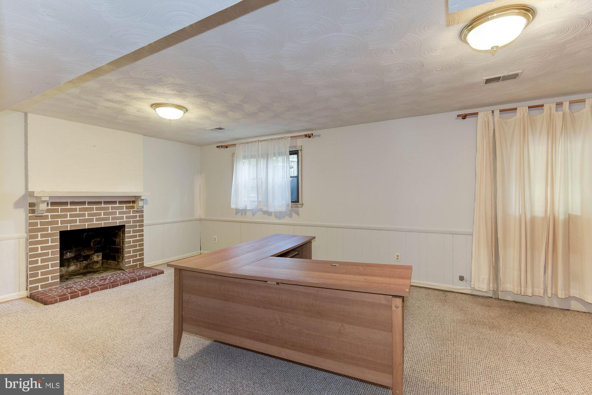 2148 Military Road Arlington, VA 22207 - Photo 23 of 28 a room with a couch and fireplace