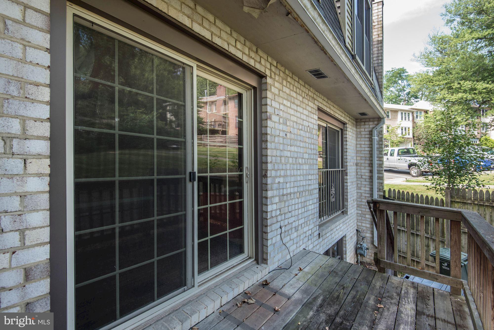 2148 Military Road Arlington, VA 22207 - Photo 26 of 28 a view of a door with a chair and a window