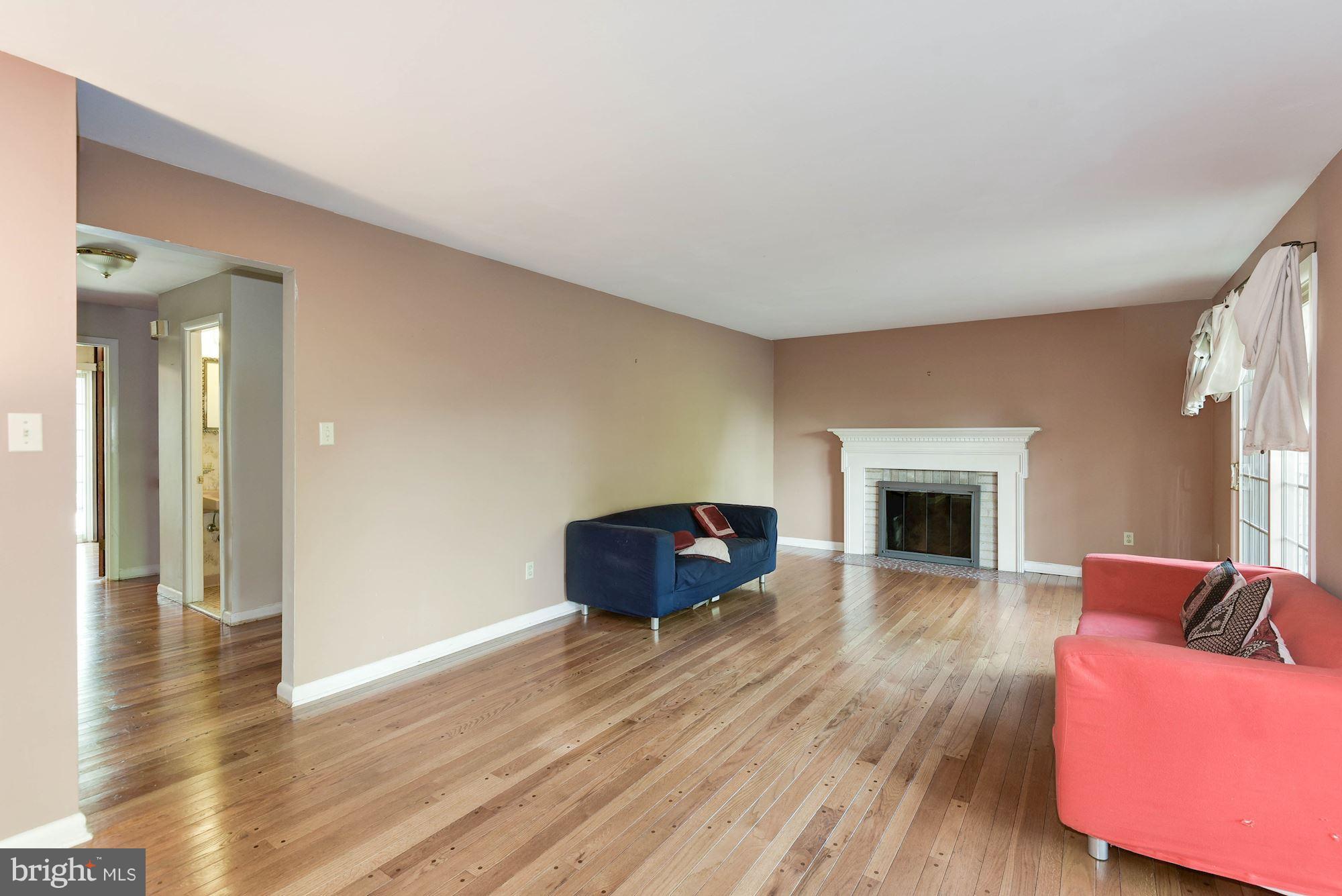 2148 Military Road Arlington, VA 22207 - Photo 6 of 28 a living room with furniture and a fireplace