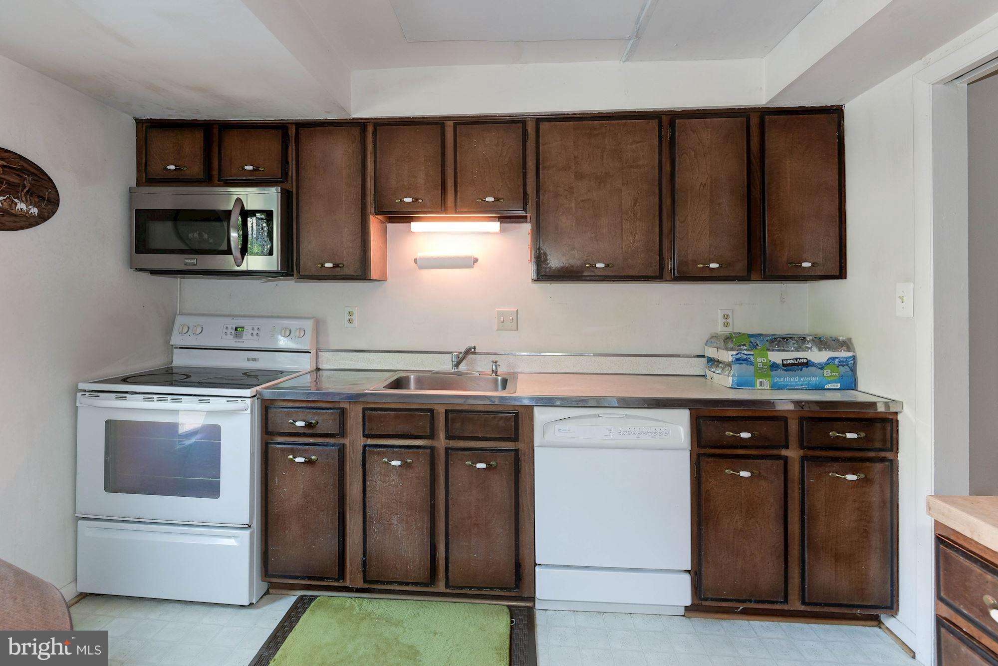 2148 Military Road Arlington, VA 22207 - Photo 7 of 28 a kitchen with stainless steel appliances granite countertop a stove and a sink