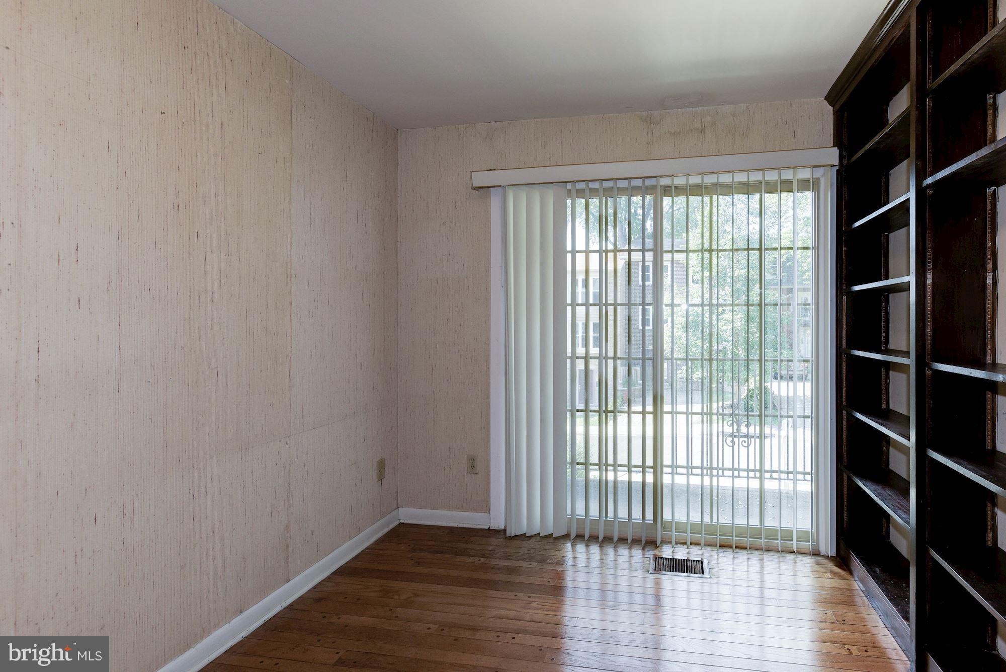 2148 Military Road Arlington, VA 22207 - Photo 8 of 28 a view of empty room with wooden floor and fan