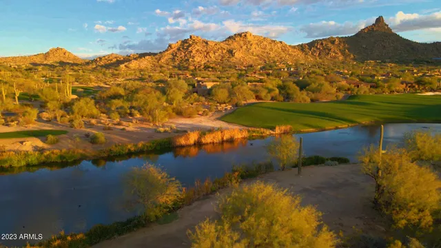 a view of a water pond with lots of green space