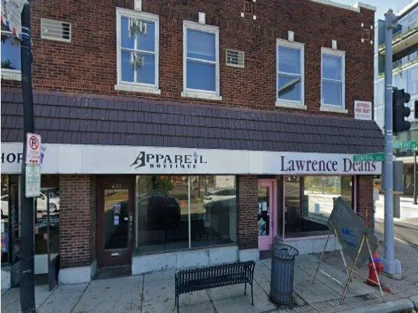 a view of a building with retail shops