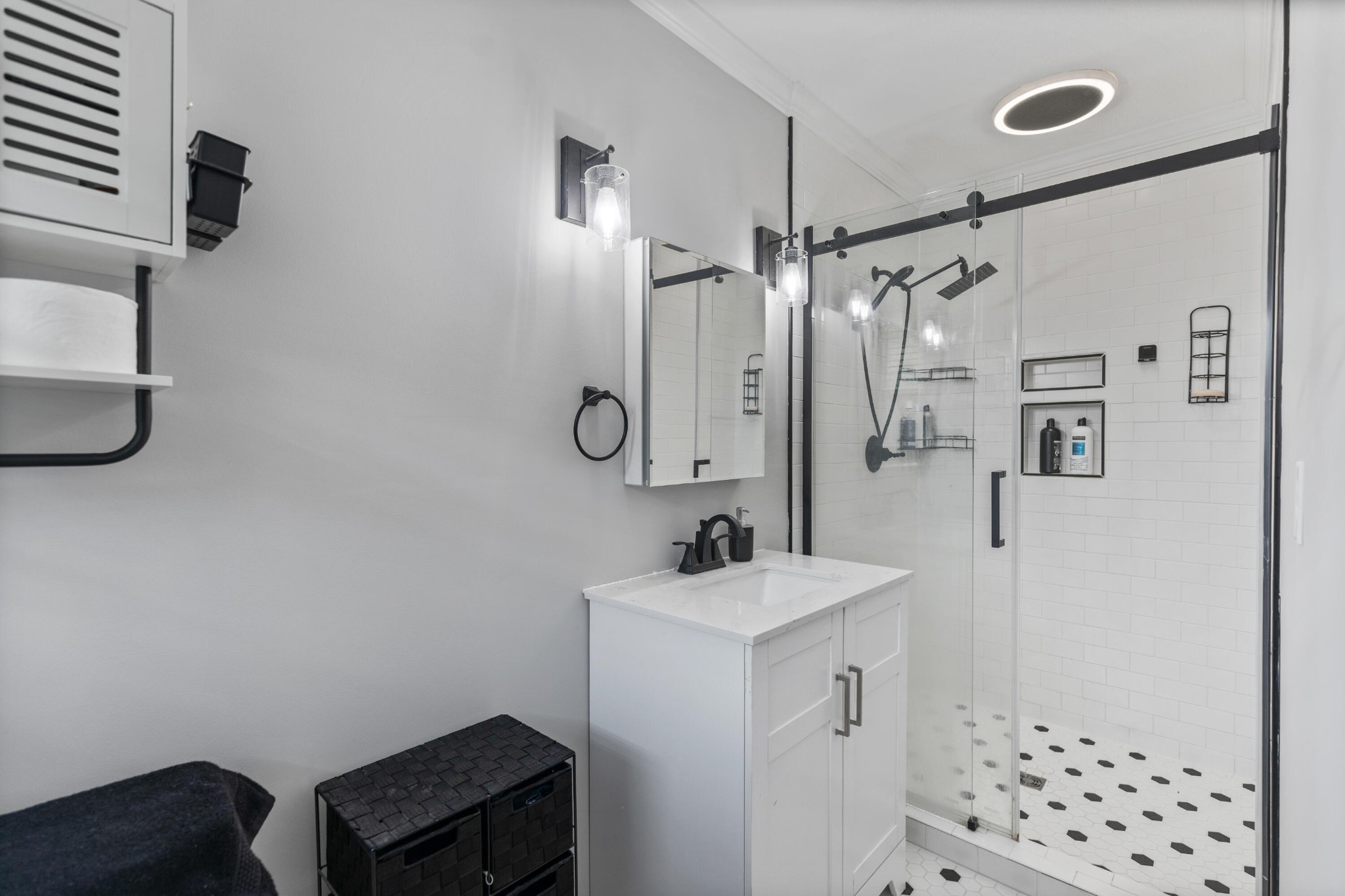 2000 Georgetown Road Northwest Cleveland, TN 37311 - Photo 17 of 36 a bathroom with a sink a mirror a vanity and a shower
