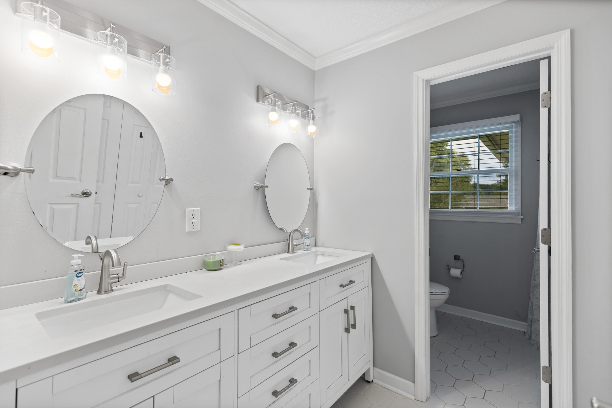 2000 Georgetown Road Northwest Cleveland, TN 37311 - Photo 19 of 36 a bathroom with a double vanity sink and a mirror
