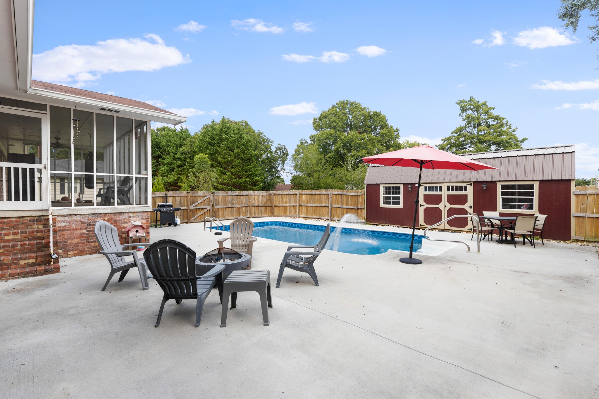 2000 Georgetown Road Northwest Cleveland, TN 37311 - Photo 23 of 36 a view of a patio with a table and chairs under an umbrella