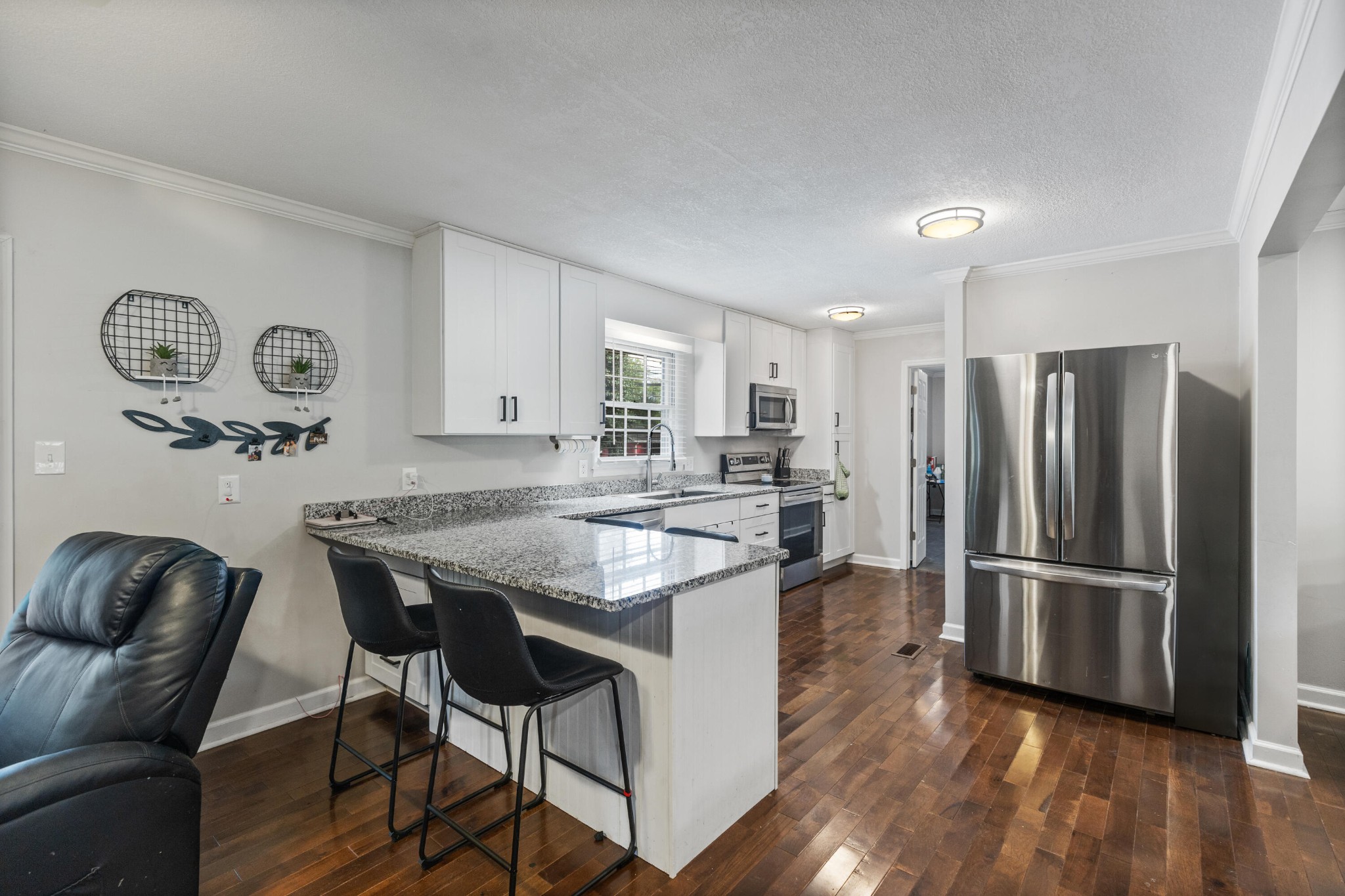 2000 Georgetown Road Northwest Cleveland, TN 37311 - Photo 8 of 36 a kitchen with stainless steel appliances granite countertop a refrigerator and a stove top oven