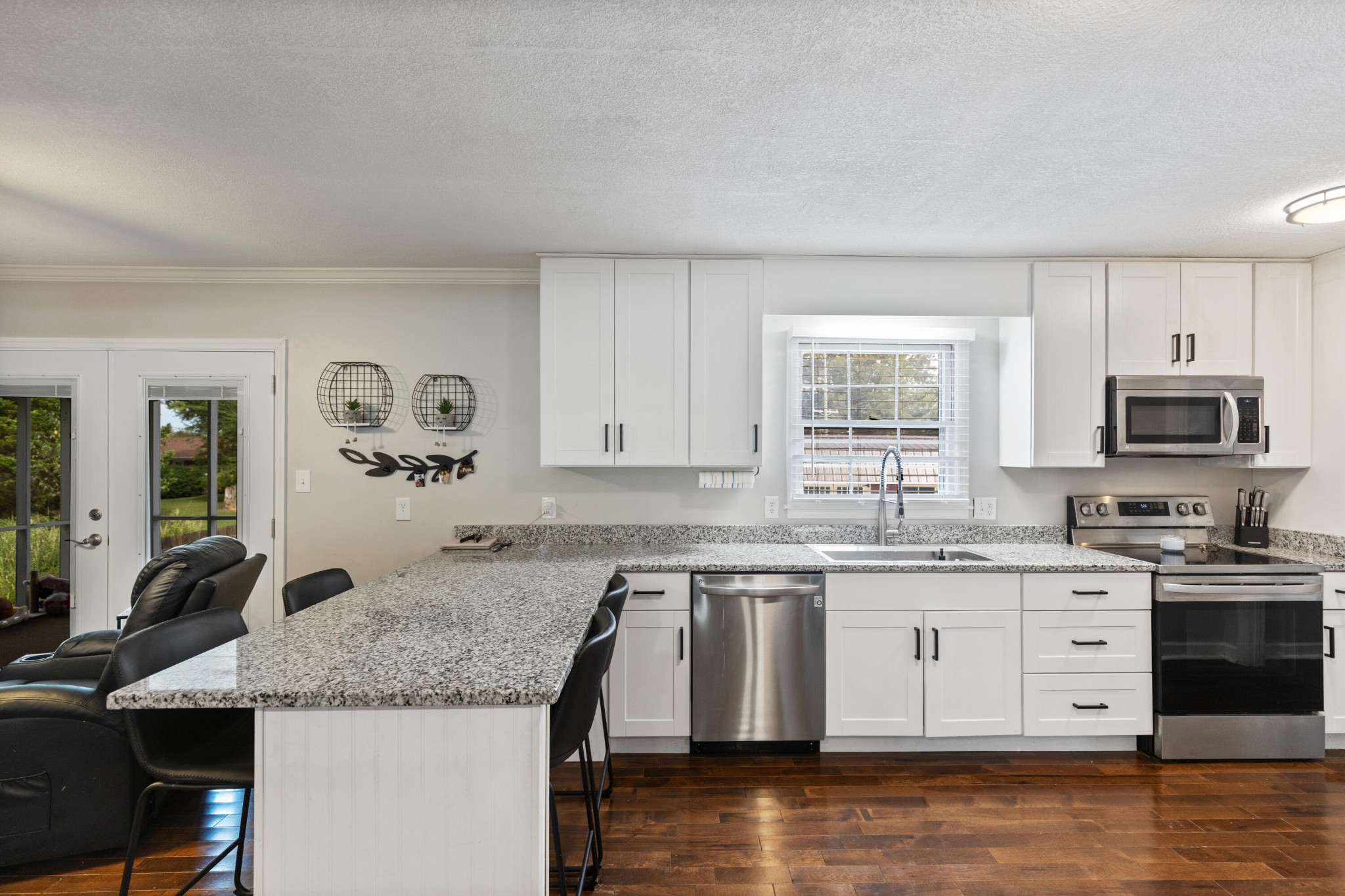 2000 Georgetown Road Northwest Cleveland, TN 37311 - Photo 9 of 36 a kitchen with granite countertop a sink and cabinets