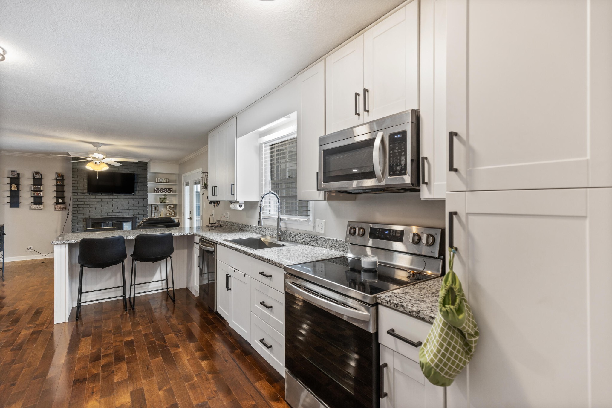 2000 Georgetown Road Northwest Cleveland, TN 37311 - Photo 10 of 36 a kitchen with stainless steel appliances a stove microwave and sink