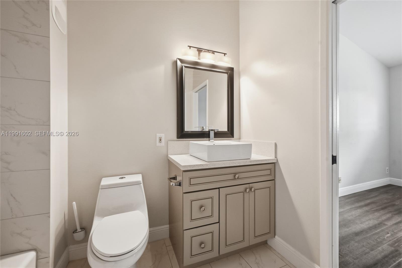 6215 Old Court Road, Unit 505 Boca Raton, FL 33433 - Photo 17 of 36 a bathroom with a toilet sink and mirror