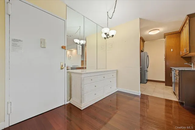 a bathroom with a double vanity sink mirror and shower