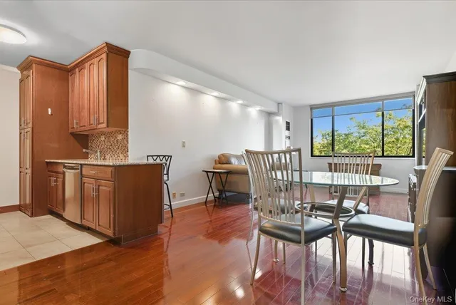 a view of a dining room with furniture window and outside view