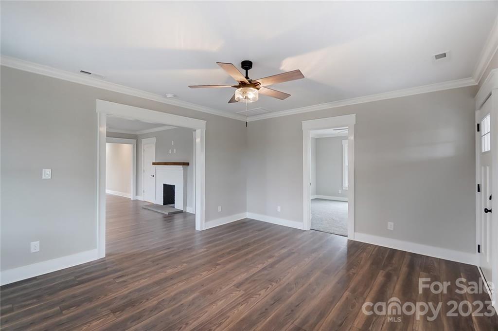 3711 Sikes Mill Road Monroe, NC 28110 - Photo 12 of 46 a view of an empty room with window and wooden floor