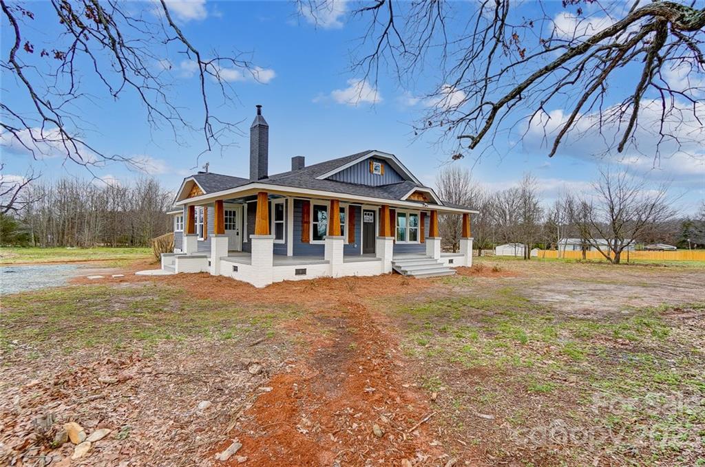 3711 Sikes Mill Road Monroe, NC 28110 - Photo 2 of 46 a front view of a house with a yard