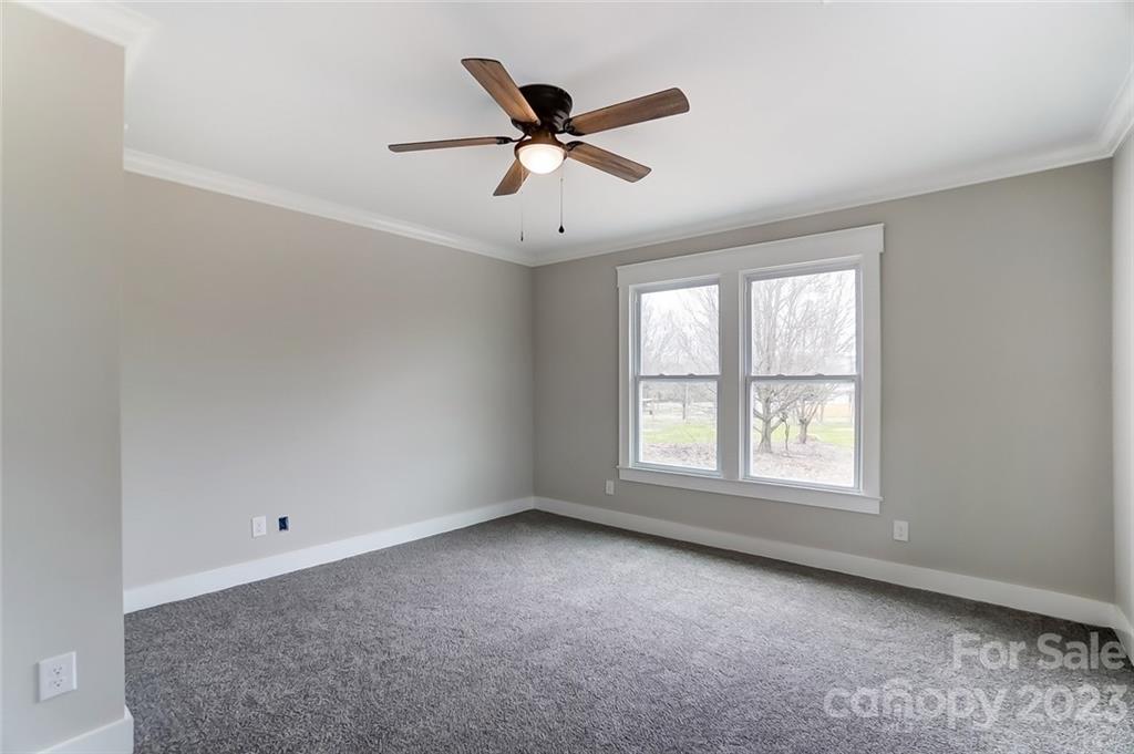 3711 Sikes Mill Road Monroe, NC 28110 - Photo 35 of 46 a view of a livingroom with a ceiling fan and window