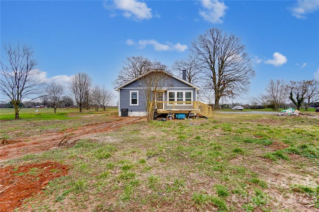 3711 Sikes Mill Road Monroe, NC 28110 - Photo 41 of 46 a front view of a house with a yard