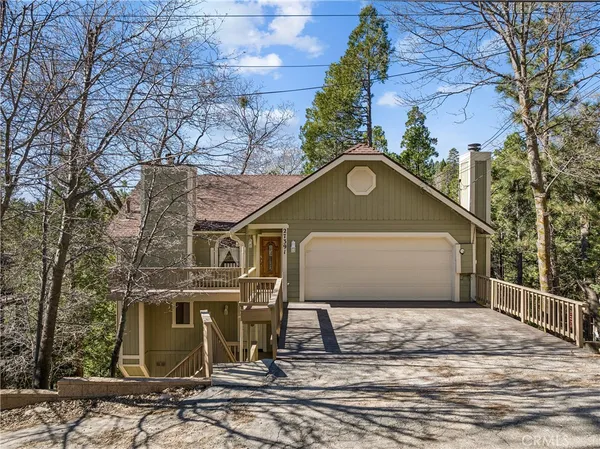 a front view of a house with yard