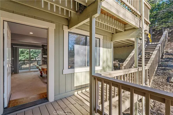 a view of a house with wooden fence