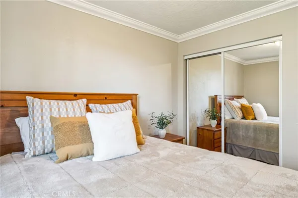 a bedroom with furniture and a window