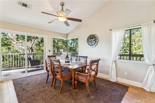 a view of a dining room and furniture window and wooden floor