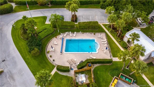 a view of a swimming pool with sitting area