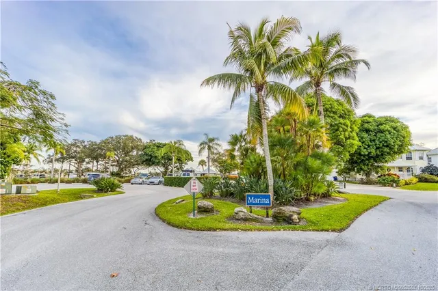 an aerial view of a houses with yard