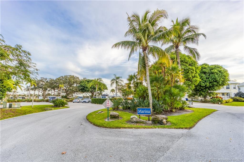 3901 Southeast St Lucie Boulevard, Unit B14 Stuart, FL 34997 - Photo 29 of 37 a view of a swimming pool with a yard