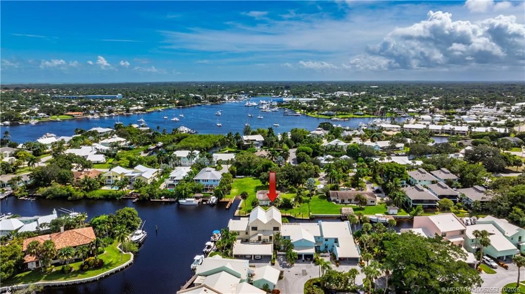 3901 Southeast St Lucie Boulevard, Unit B14 Stuart, FL 34997 - Photo 31 of 37 an aerial view of residential houses with outdoor space and lake view in back