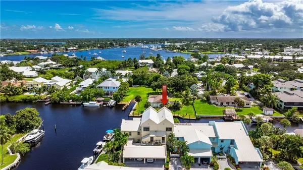 an aerial view of a house with a lake view