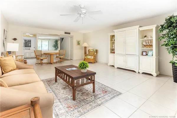a living room with furniture and a table