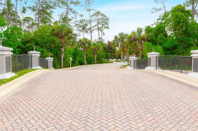 a park view with a bench next to yard