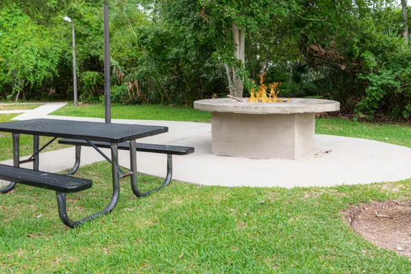 a view of a backyard with sitting area