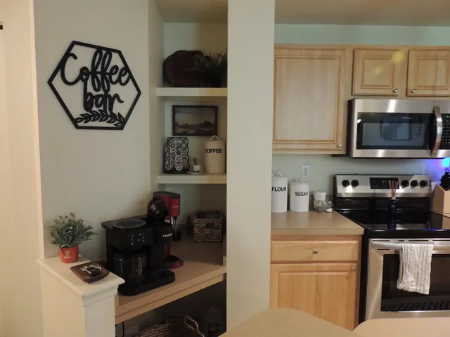 a kitchen with a microwave and cabinets